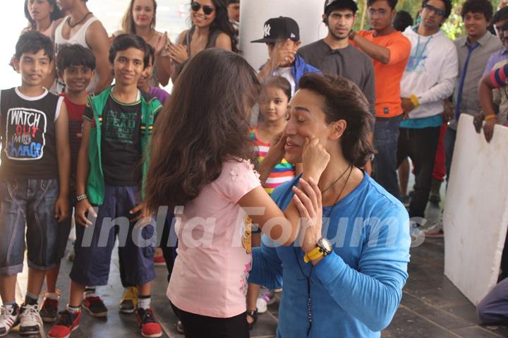 A small girl was snapped pulling Tiger Shroff's cheeks at T-Series Music Video Shoot