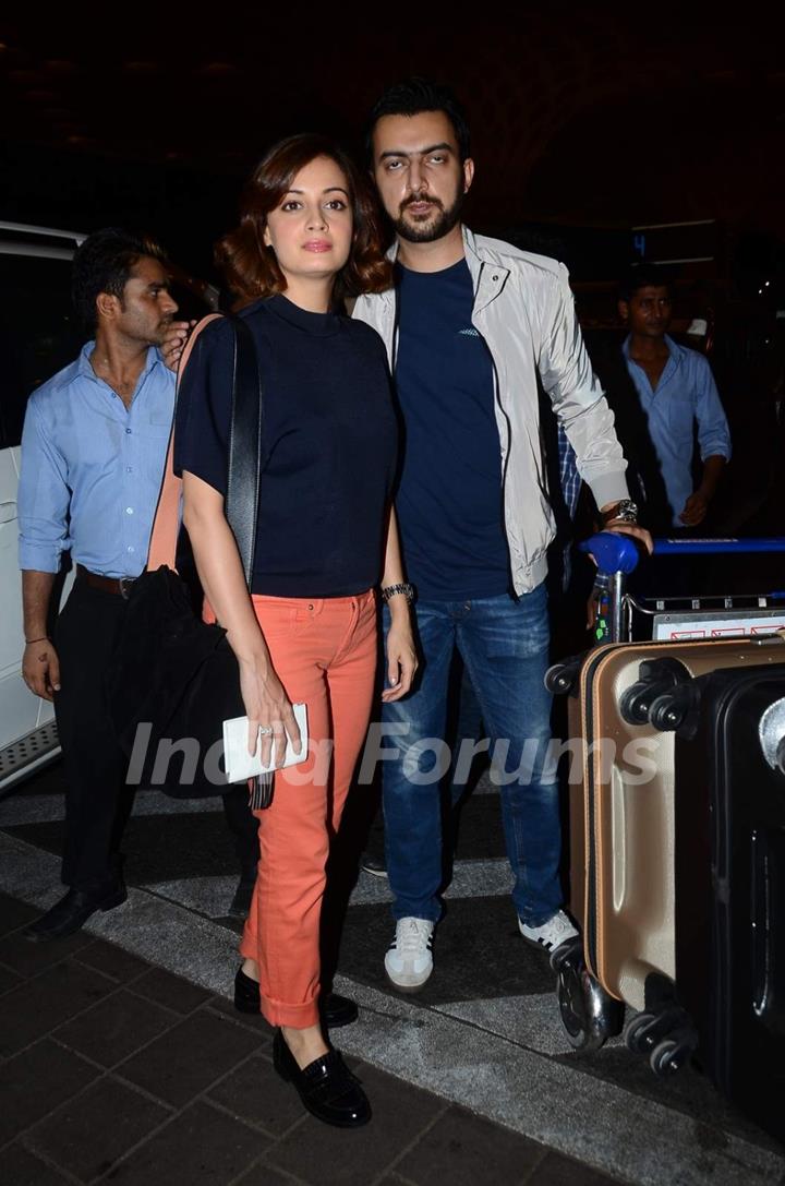 Dia Mirza and Sahil Sangha pose for the media at Airport while leaving for IIFA 2015