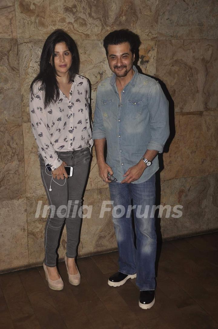 Sanjay Kapoor poses with Wife at the Screening of Bajrangi Bhaijaan