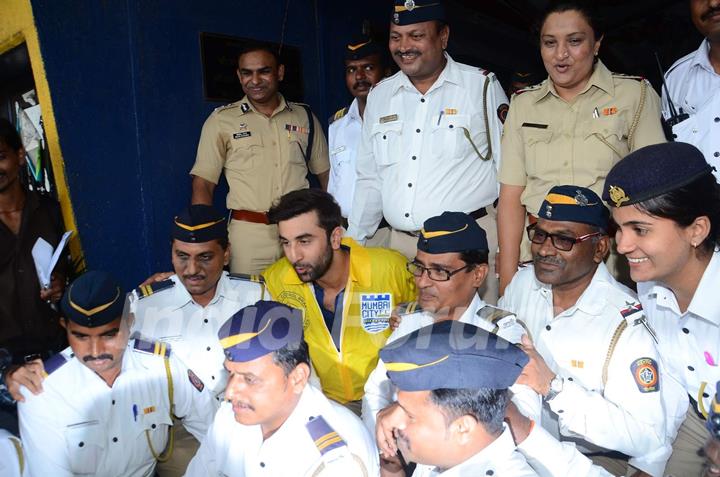 Ranbir Kapoor Clicks a Picture at Mumbai FC Raincoat Distribution for Mumbai Traffic Cops