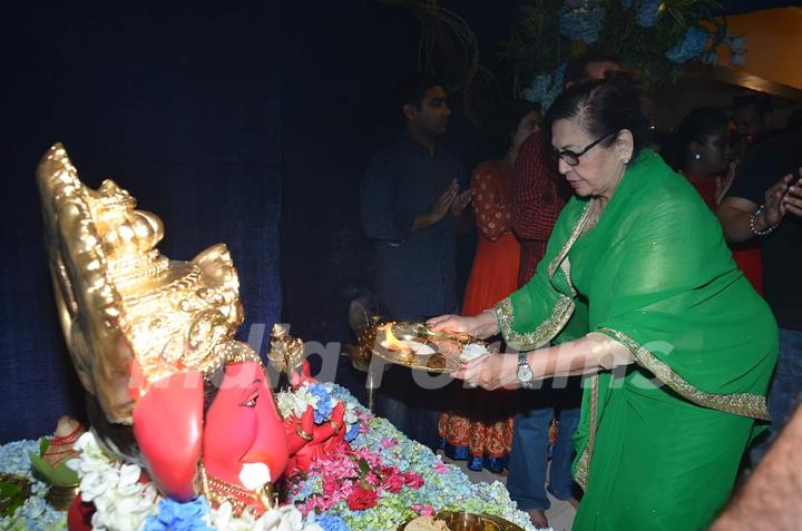 Helen Offers Prayer to Ganesh at Home