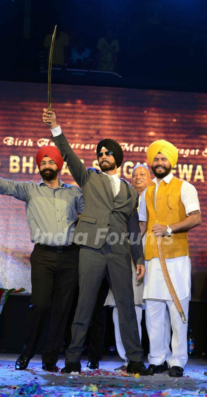 Akshay Kumar poses with the talvar during the Promotions of Singh is Bling in Delhi