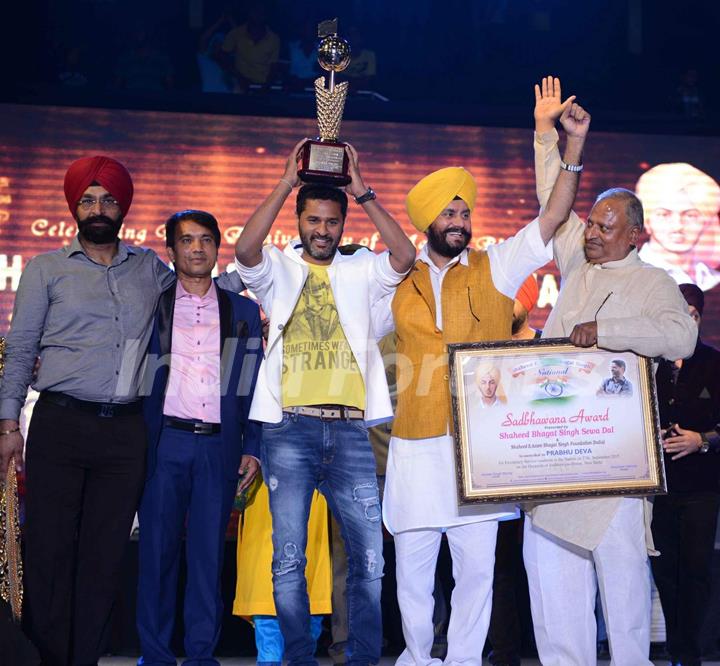 Prabhu Dheva poses with the trophy during the Promotions of Singh is Bling in Delhi