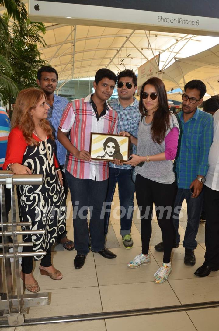 Shraddha Kapoor poses with a fan at Airport