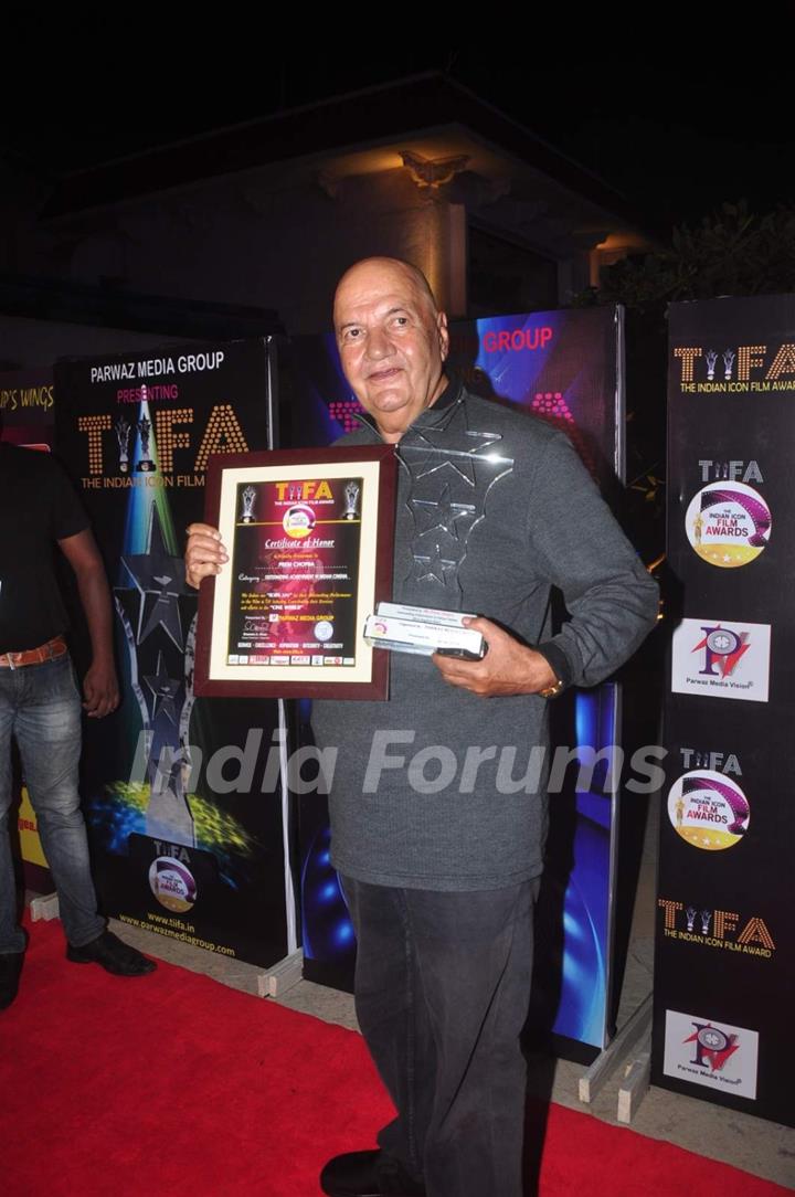 Prem Chopra poses with his awards at TIFA Awards