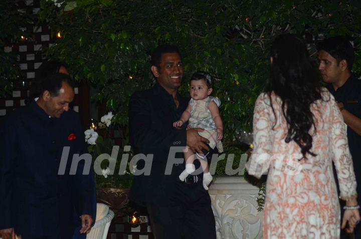 Dhoni was snapped holding baby daughter Ziva at Mukesh and Nita Ambani's Bash