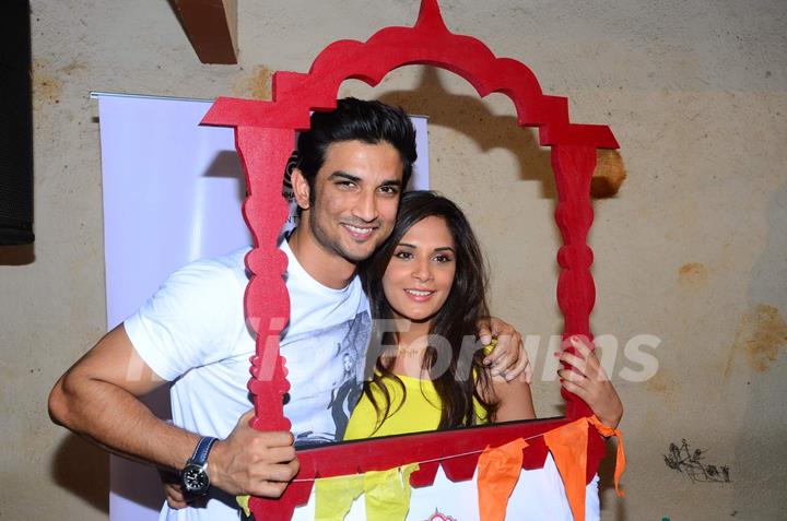 Richa Chadda and Sushant Singh Rajput pose for the media at Khidkiyan Theater Festival