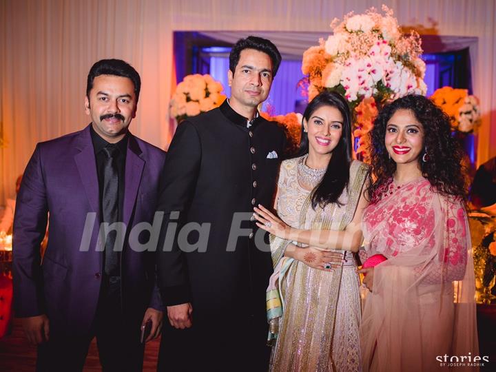 Asin Thottumkal and Micromax Founder Rahul Sharma Poses with friends at Wedding Reception