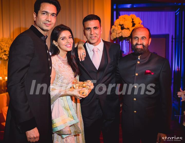 Akshay Kumar Poses with the Newly Married Couple Asin & Rahul Sharma at their Wedding Reception