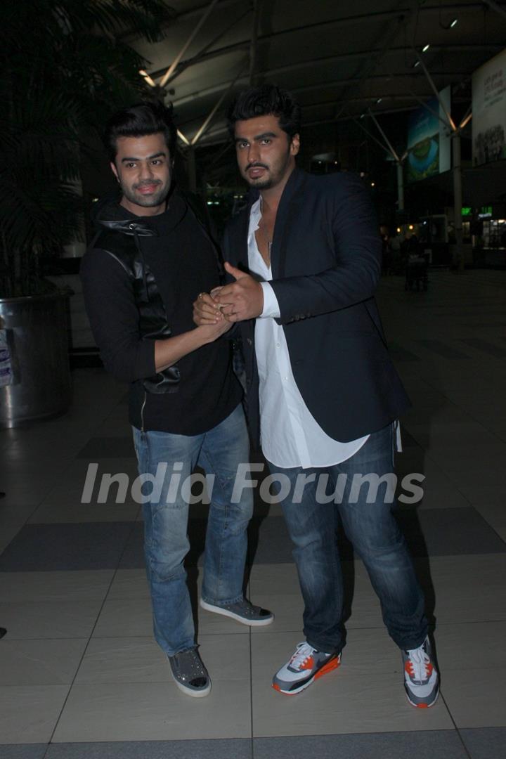 Arjun Kapoor and Manish Paul pose for the media at Airport