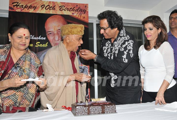 Talat Aziz feeding cake to Khayyam Saab on his 90th Birth Anniversary