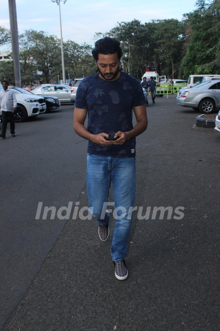 Engrossed: Riteish Deshmukh Snapped at Airport