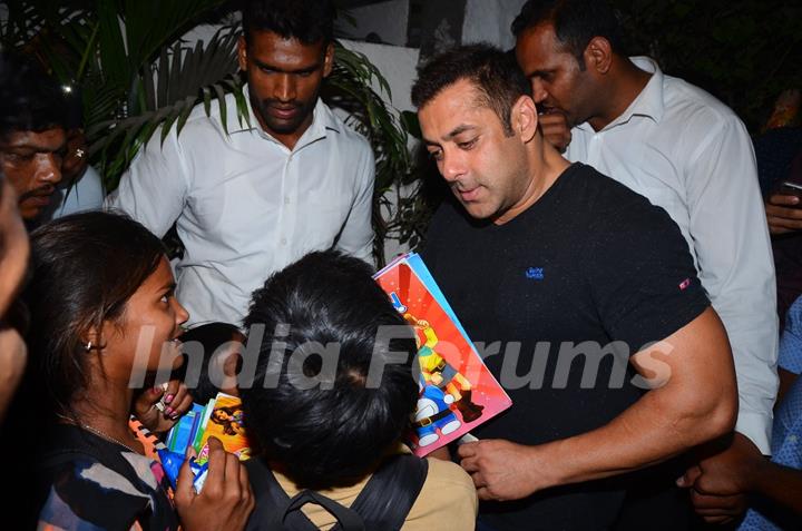 Salman Khan Snapped Distributing books to street Kids Outside Olive