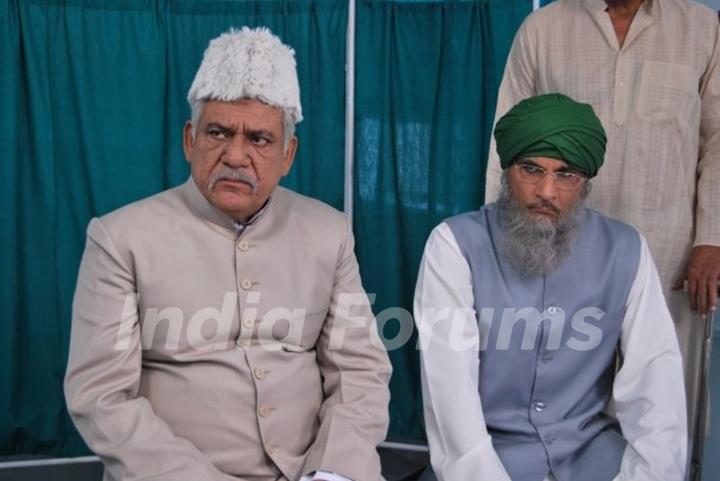 Ompuri and Pavan Malhotra looking angry