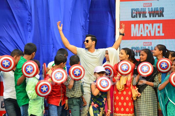 Varun Dhawan Poses with Children at Promotions of Marvel's Captain America