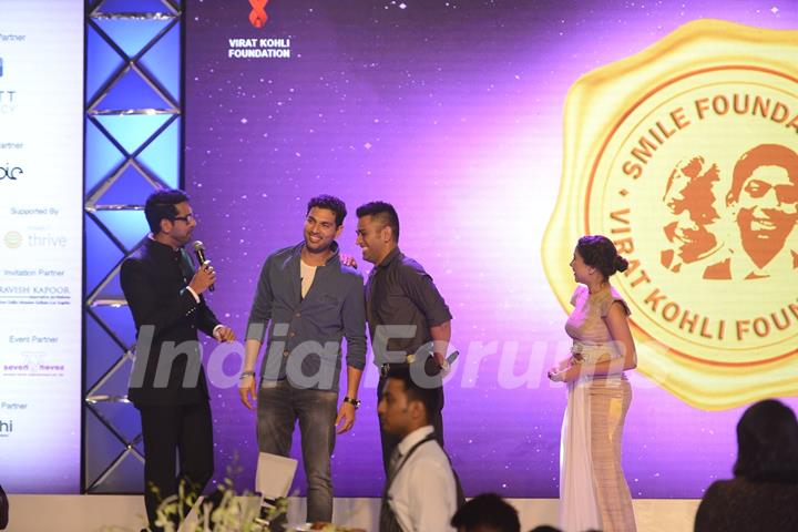 Yuvraj Singh and Mahendra Singh Dhoni at Virat Kohli's Charity Auction