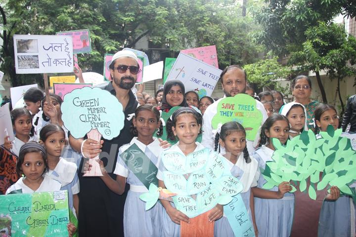 Ajaz Khan poses with children at 'Van Mahotsav Week'