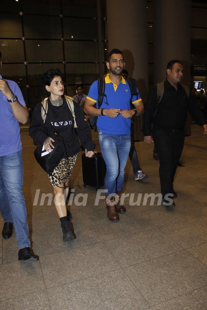 Mahendra Singh Dhoni snapped at airport