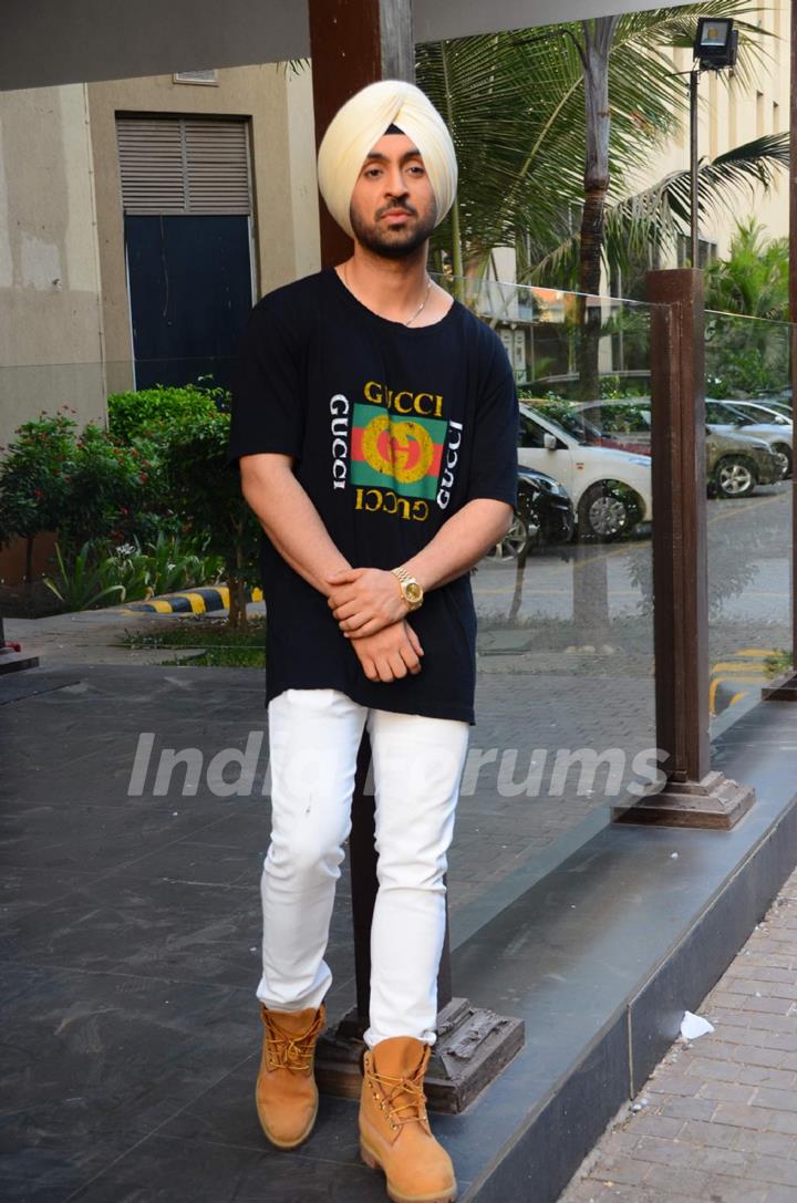 Diljit Dosanjh poses for the media