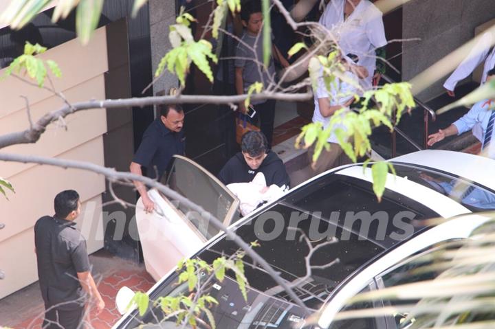 Karan Johar taking his babies home from hospital