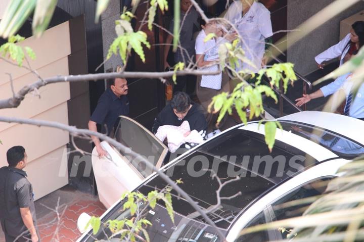 Karan Johar taking his babies home from hospital