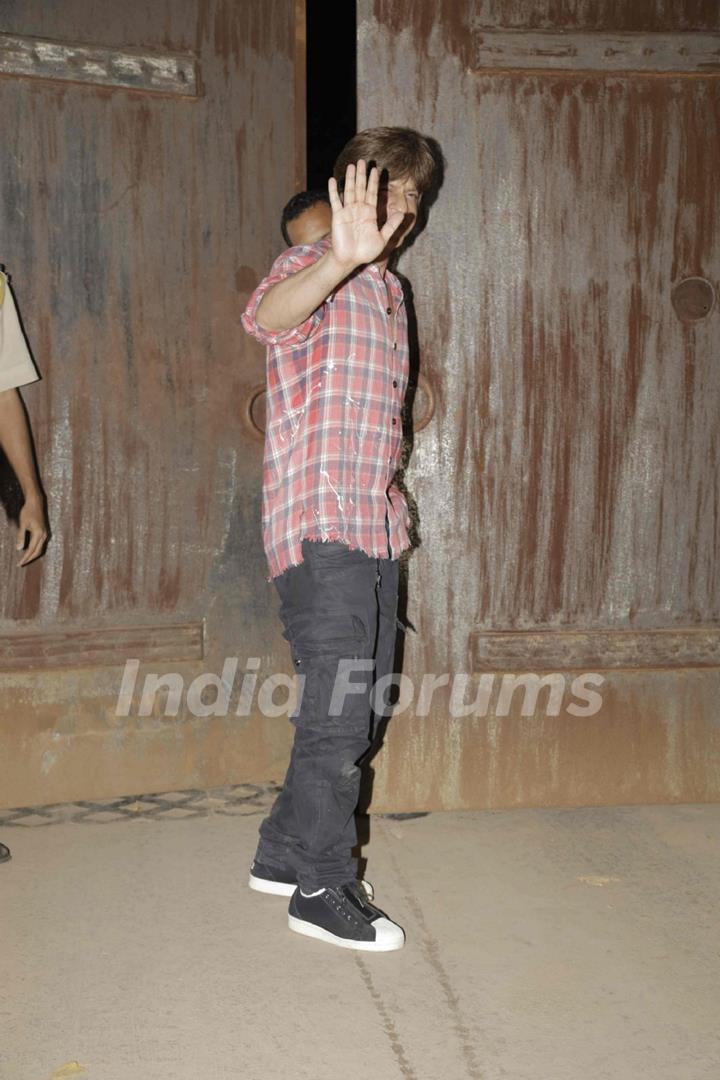 Shah Rukh Khan waves at the media