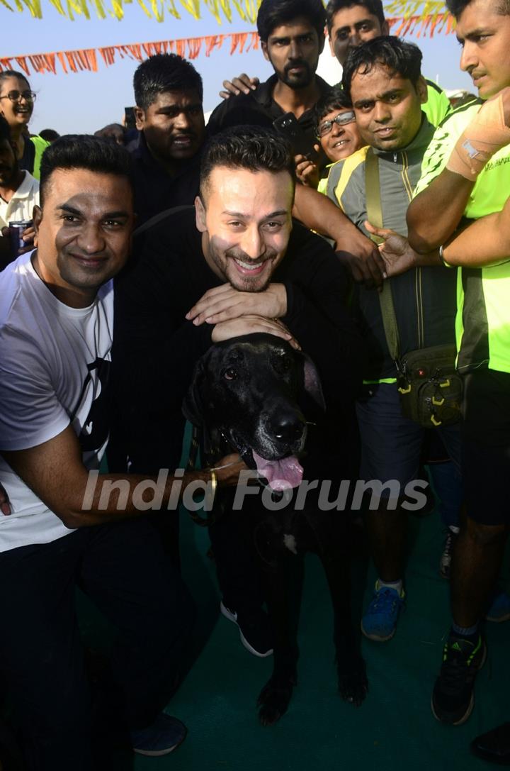Tiger Shroff poses for a click with a dog