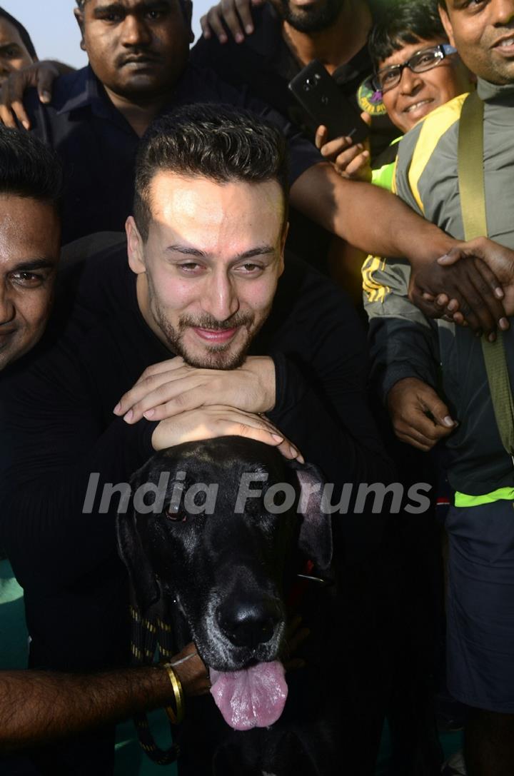 Tiger Shroff with a Dog at the event