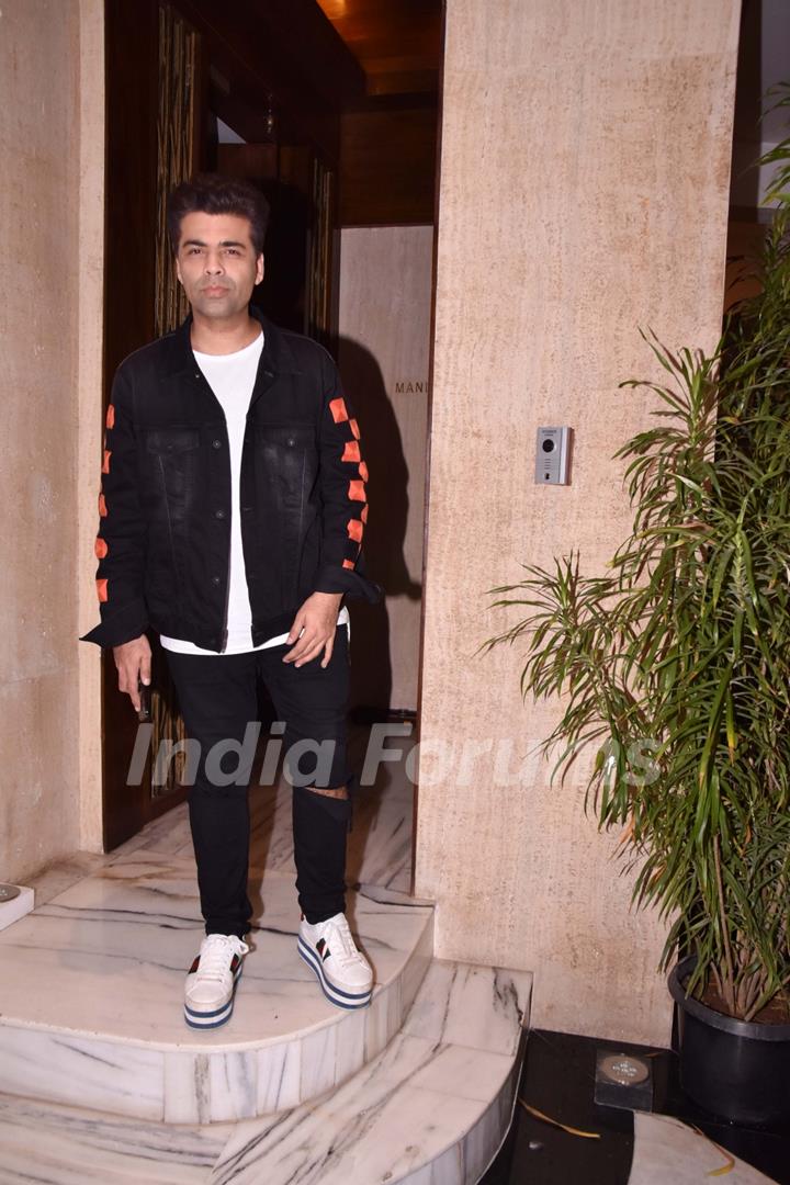 Karan Johar striking a pose after the dinner