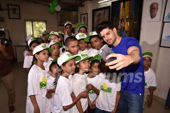 Sooraj poses for a selfie with the kids