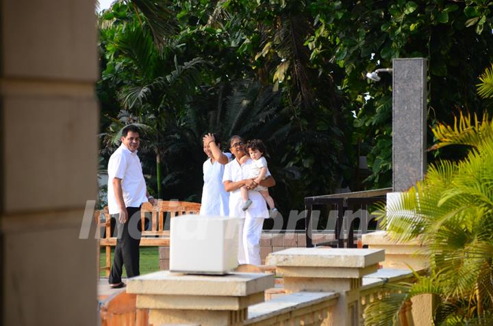 Taimur Ali Khan walking by the poolside