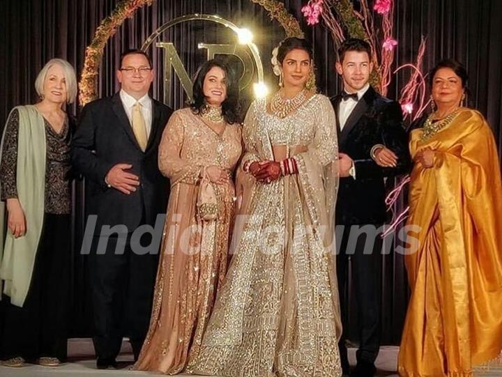 Priyanka and Nick with their family at their Wedding Reception Delhi