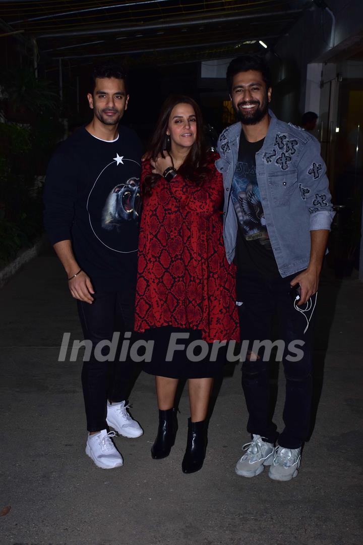 Angad Bedi and Neha Dhupia with Vicky Kaushal snapped during the screening of 'URI'