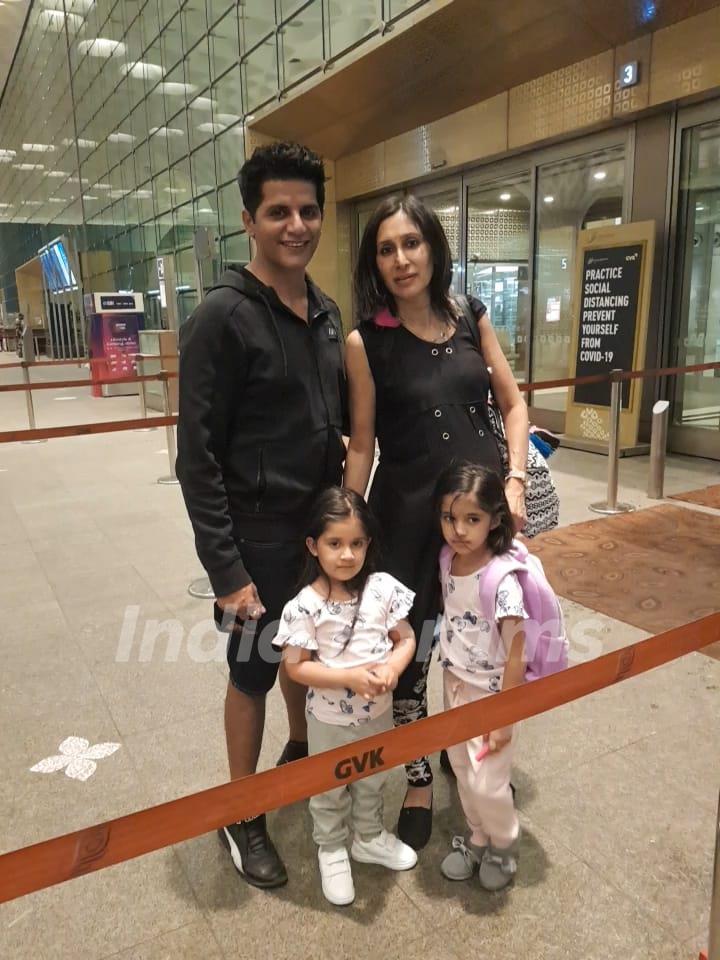 Karanvir Bohra sees off wife Teeajy and his twin girls as they fly off to Canada