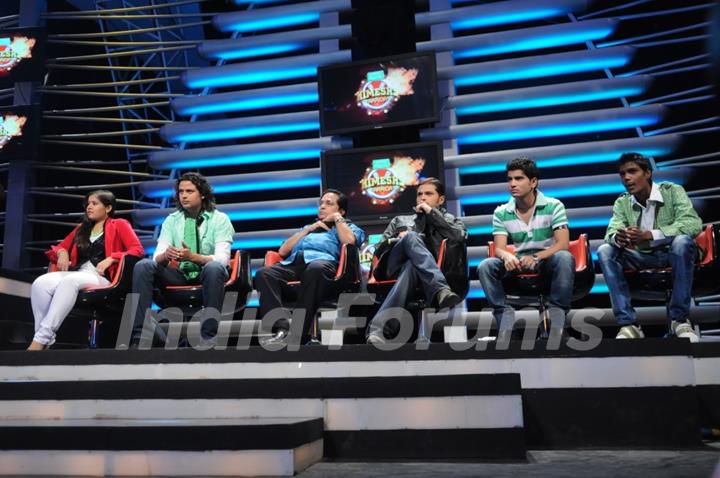 Himesh sitting with his team