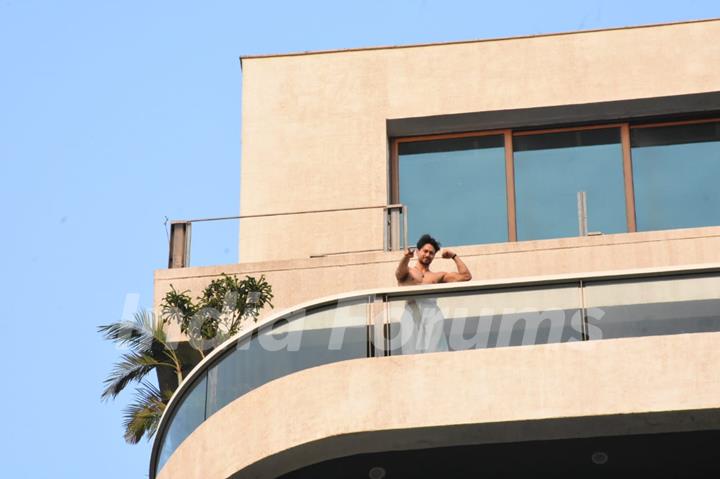 Tiger Shroff snapped flexing muscles in his balcony