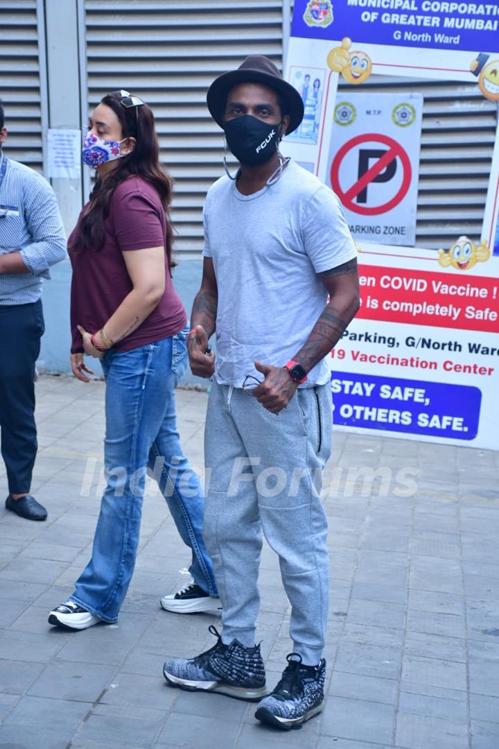 Remo D'Souza with wife Lizelle D'Souza spotted at Dadar vaccination centre