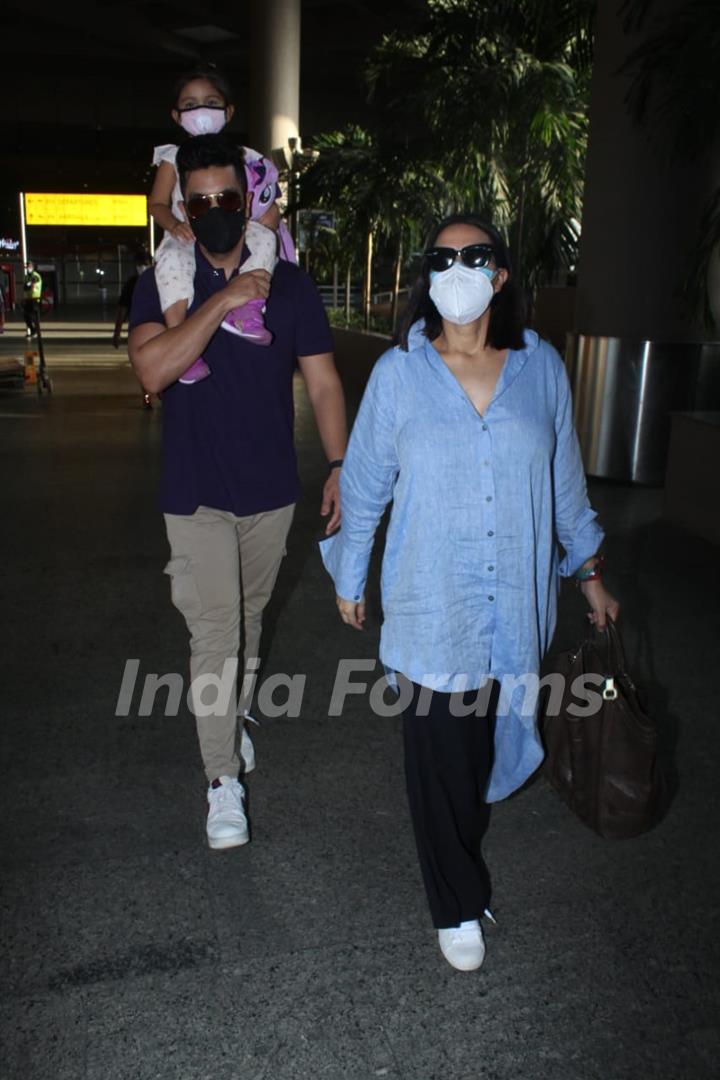 Neha Dhupia and Angad Bedi snapped arriving at Mumbai airport on Monday