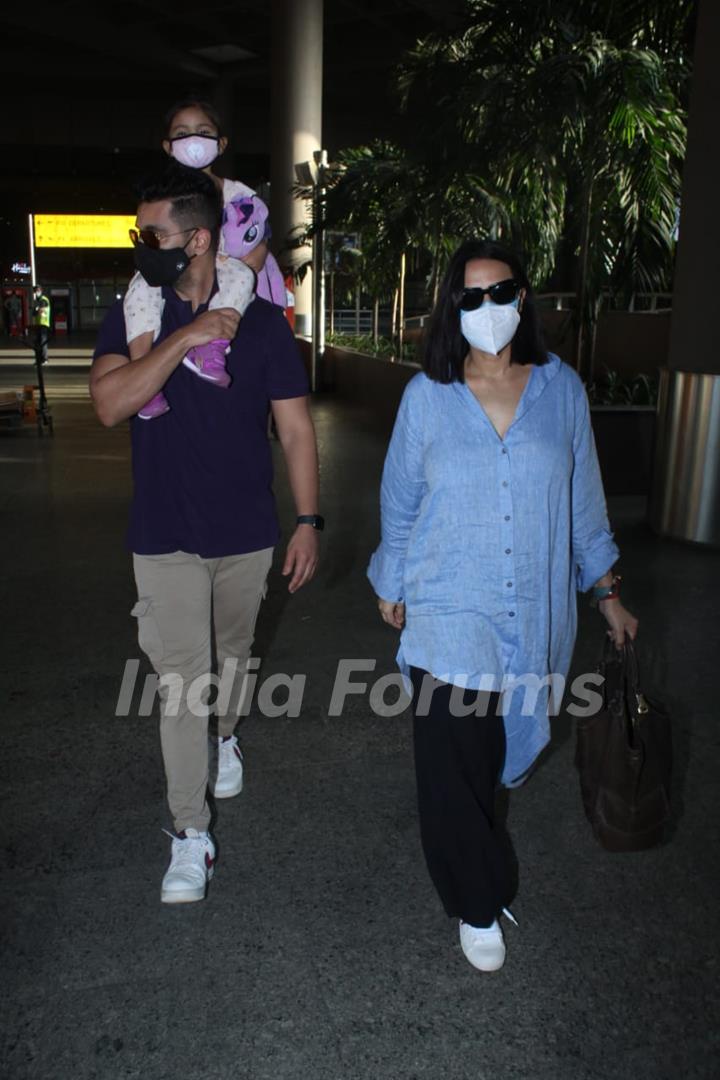 Neha Dhupia and Angad Bedi snapped arriving at Mumbai airport on Monday