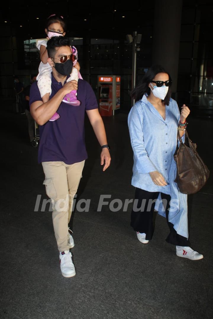 Neha Dhupia and Angad Bedi snapped arriving at Mumbai airport on Monday