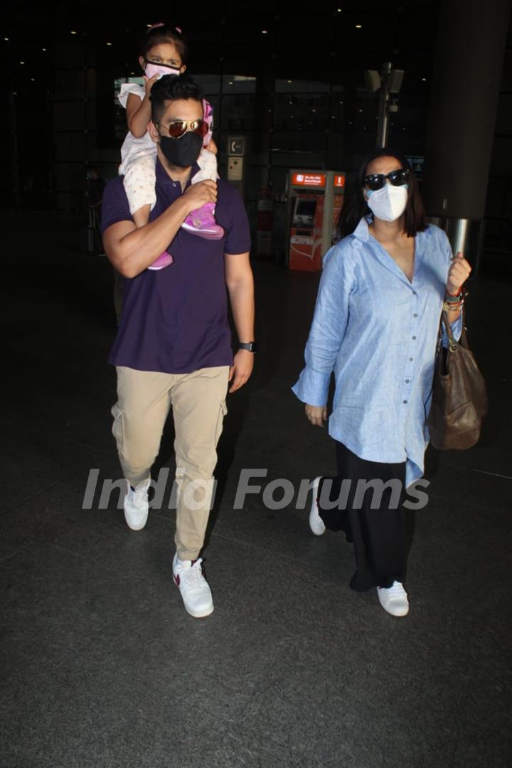 Neha Dhupia and Angad Bedi snapped arriving at Mumbai airport on Monday