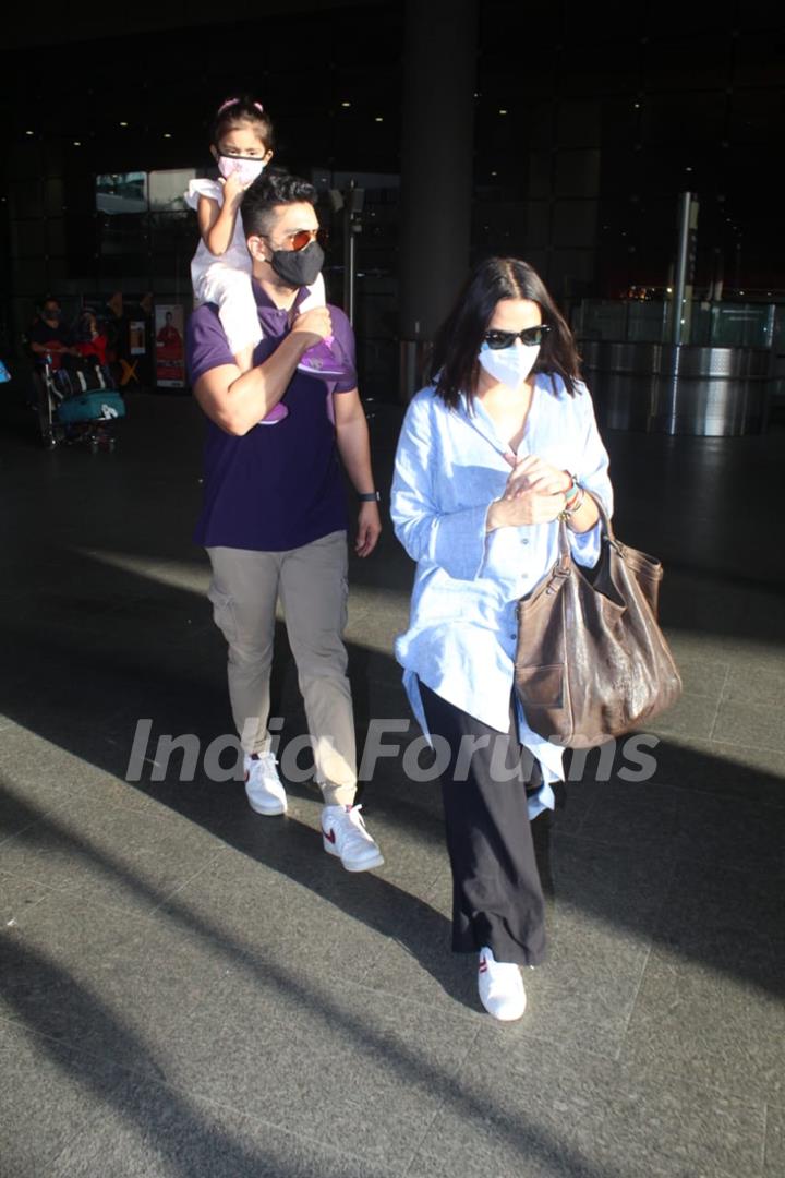 Neha Dhupia and Angad Bedi snapped arriving at Mumbai airport on Monday