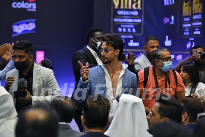 Tiger Shroff poses to paparazzi at IIFA awards press conference in Abu Dhabi