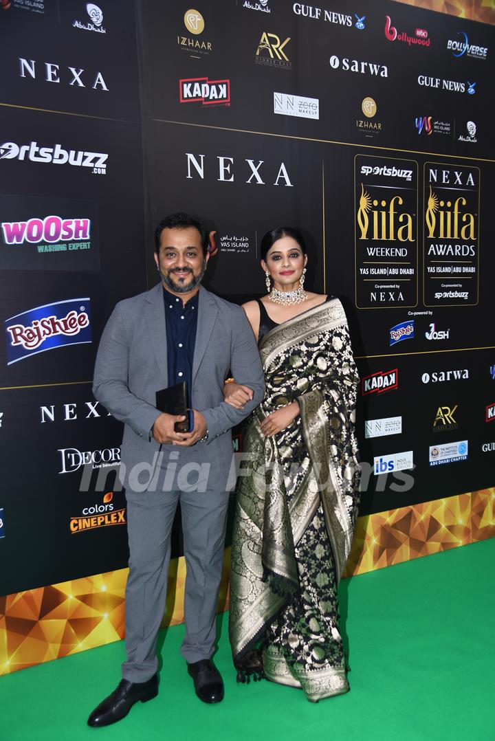 Priyamani with husband Mustafa Raj poses to paparazzi at green carpet of IIFA awards 2022 in Abu Dhabi