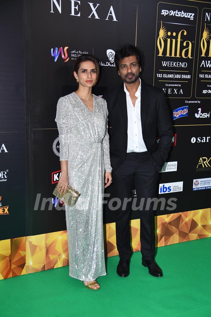 Nikhil Dwivedi and his wife Gaurie poses to paparazzi at green carpet of IIFA awards 2022 in Abu Dhabi