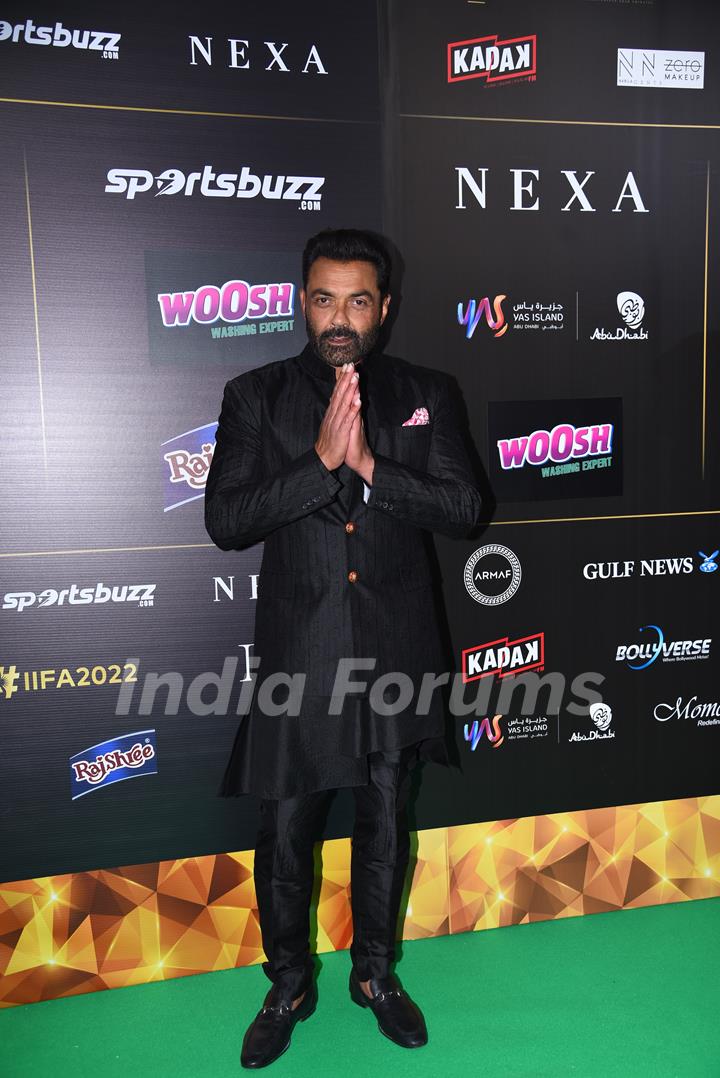 Bobby Deol poses to paparazzi at green carpet of IIFA awards 2022 in Abu Dhabi