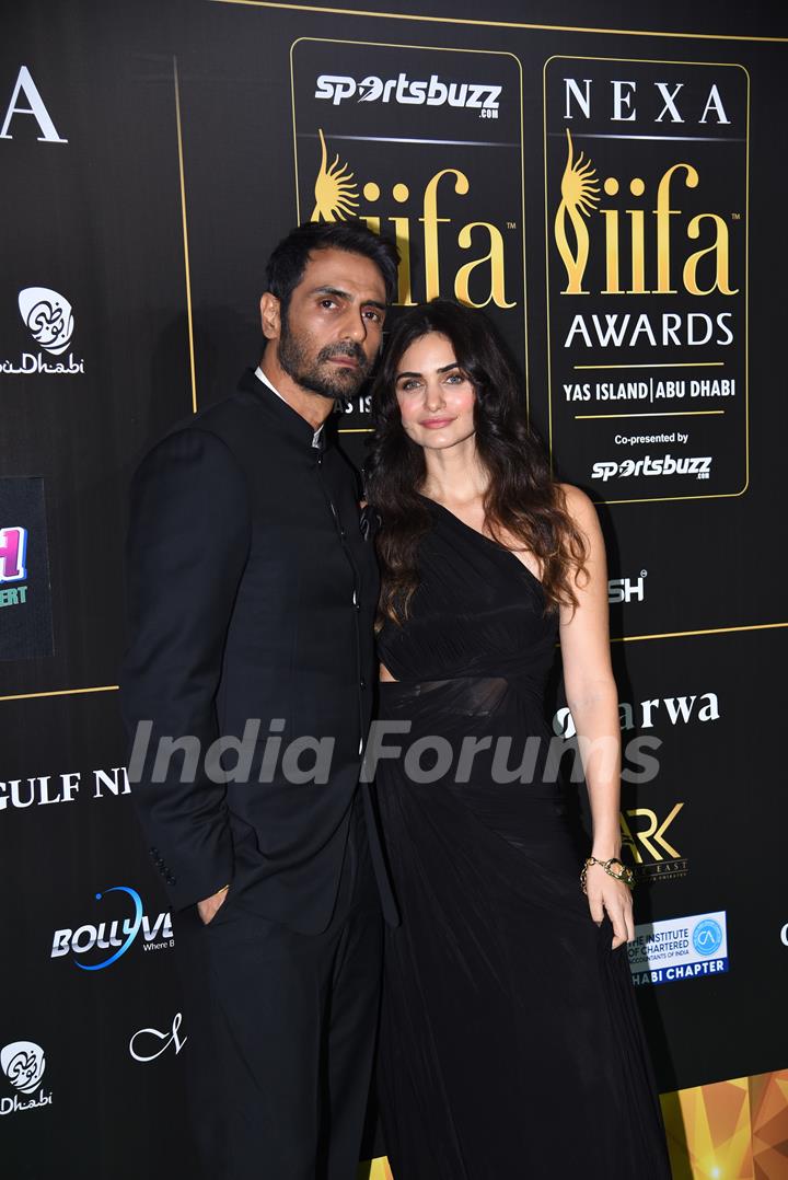 Arjun Rampal and Gabrielle Demetriades poses to paparazzi at green carpet of IIFA awards 2022 in Abu Dhabi