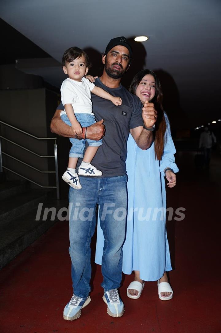 Mohit Malik, Addite Shirwaikar Malik poses with son at the Mumbai airport