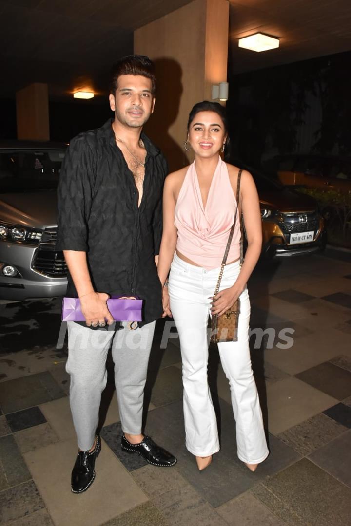 Tejasswi Prakash spotted in a baby pink halter neck top and white pants. Karan Kundrra wore a short black kurta and grey pants