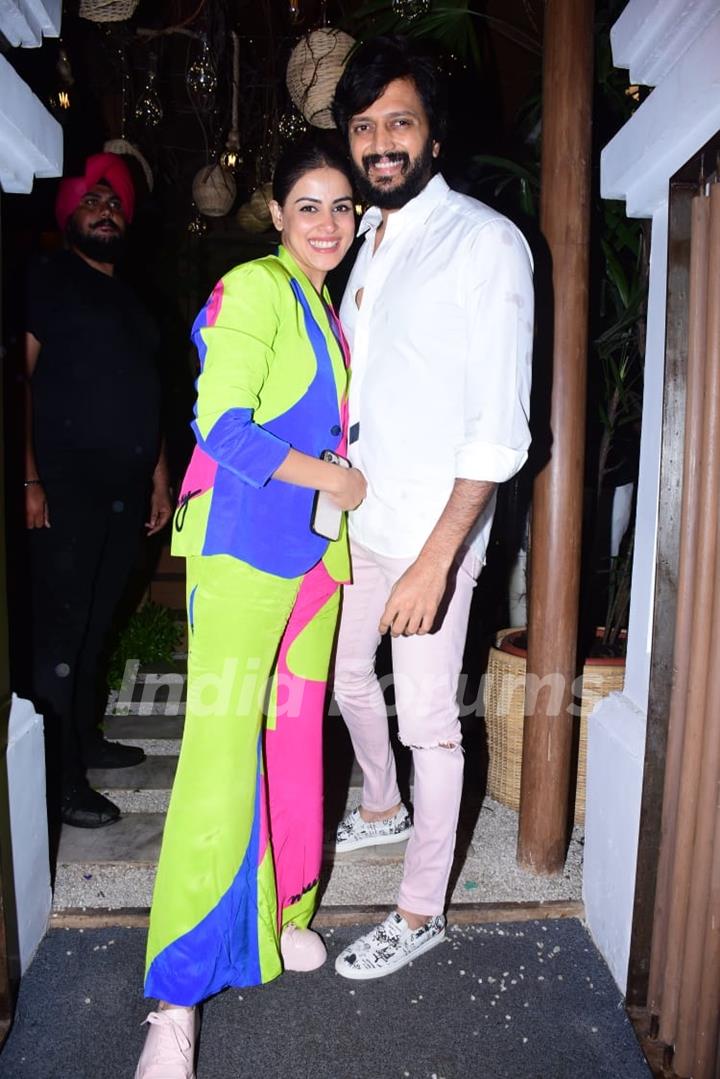 Genelia Deshmukh setting fashion goals in a multicoloured pant suit set and Riteish Deshmukh opted for a white shirt and ripped baby pink pants
